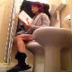 A short-haired brunette girl with dyed highlights sits down on a toilet, smokes a cigarette, reads a book, takes a shit with some quick, heavy plops, and then pisses. Over 3 minutes.